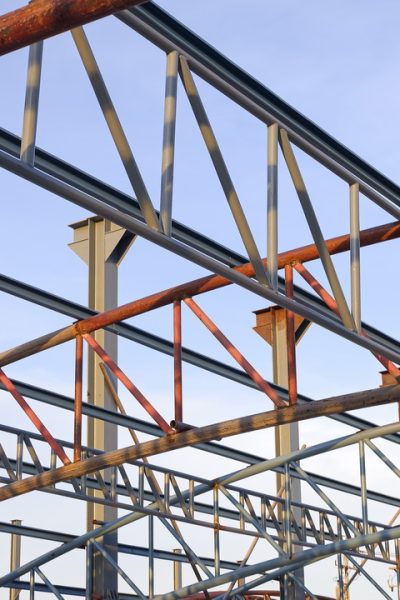 Low angle view of metal roof structure for install on top of building structure in construction site area
